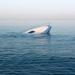 Sinking,Modern,Large,White,Boat,Goes,Underwater