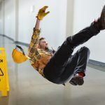 Worker,Falling,On,Wet,Floor,Inside,Building